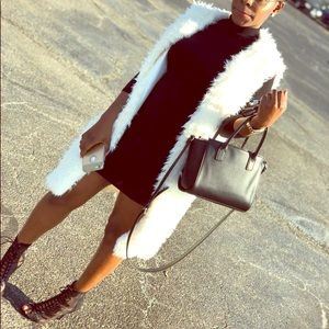 White fur vest